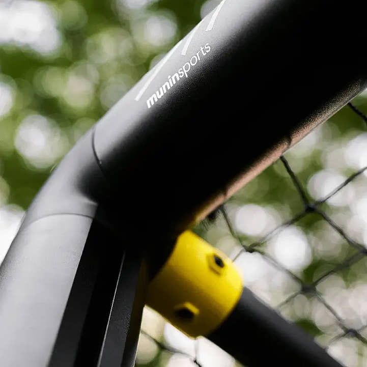 Yellow base joint of Strive M4 backyard soccer goal with net tension