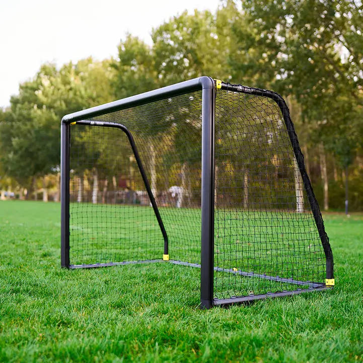 Side angle of 4x6 ft soccer goal on grass field for kids and U6–U8 play