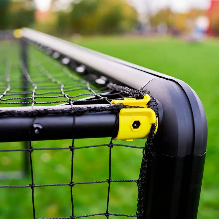 Angled rear view of backyard soccer goal showing net tension and depth