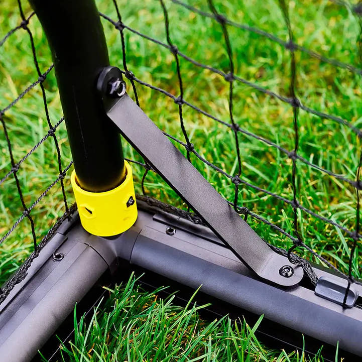 Yellow base anchor and joint on portable backyard soccer goal for kids